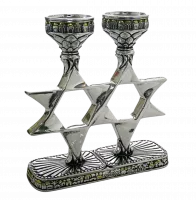 Silver candlestick in the shape of six-pointed stars