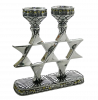 Silver candlestick in the shape of six-pointed stars