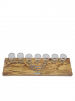 A wooden seven-candle holder with a small menorah painted on it